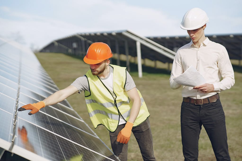 Foreman and businessman at solar energy station