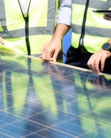 Foreman engineering male and female hardhat work job meeting electrician solar power renewable energ