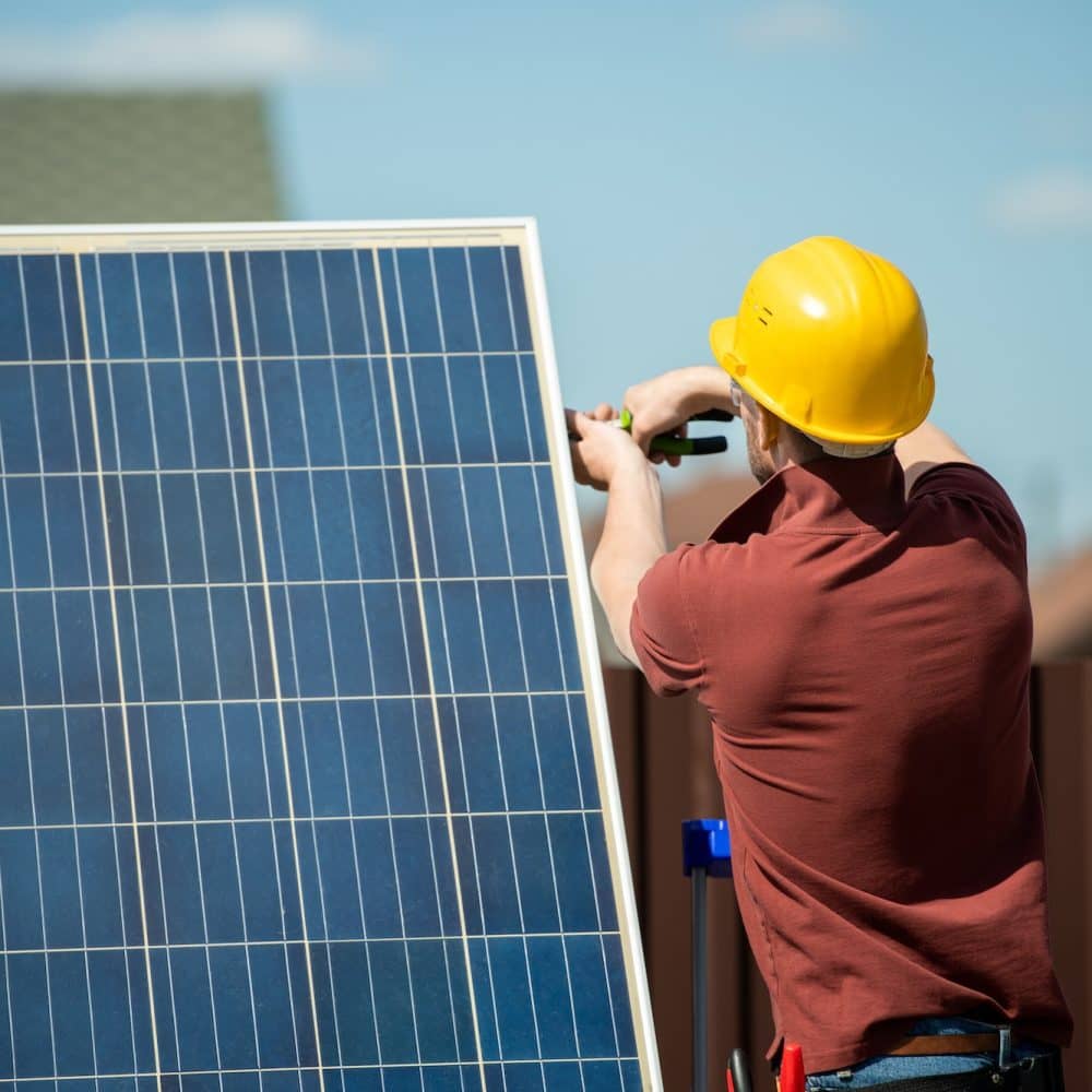 Worker Installing Photovoltaic Panel